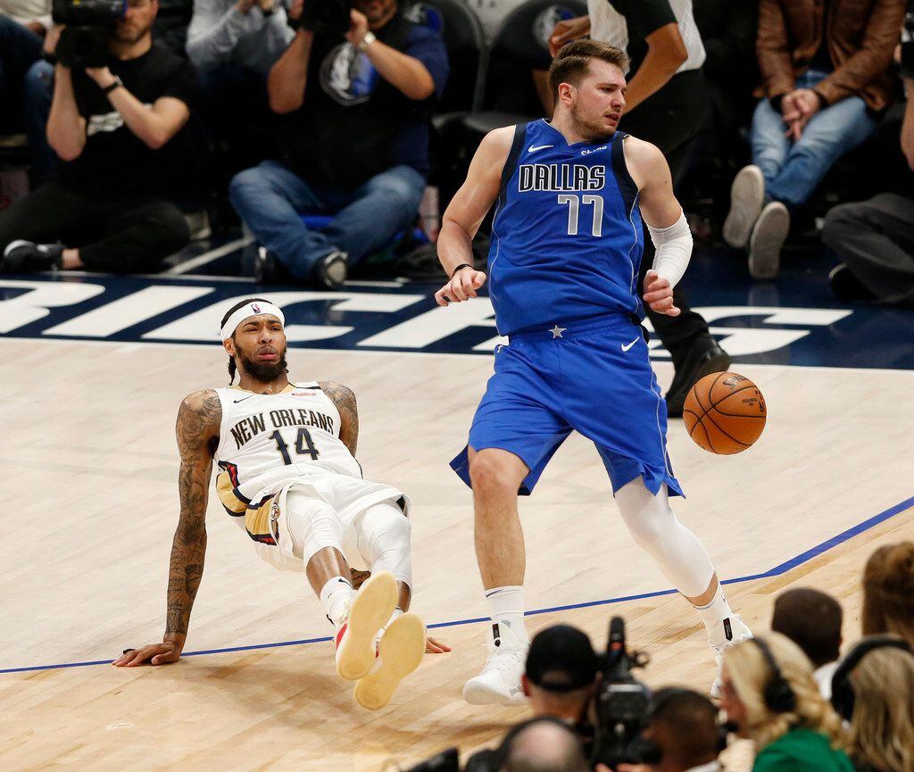 Dallas Mavericks guard Luka Doncic (77) is fouled by New Orleans Pelicans forward Brandon...