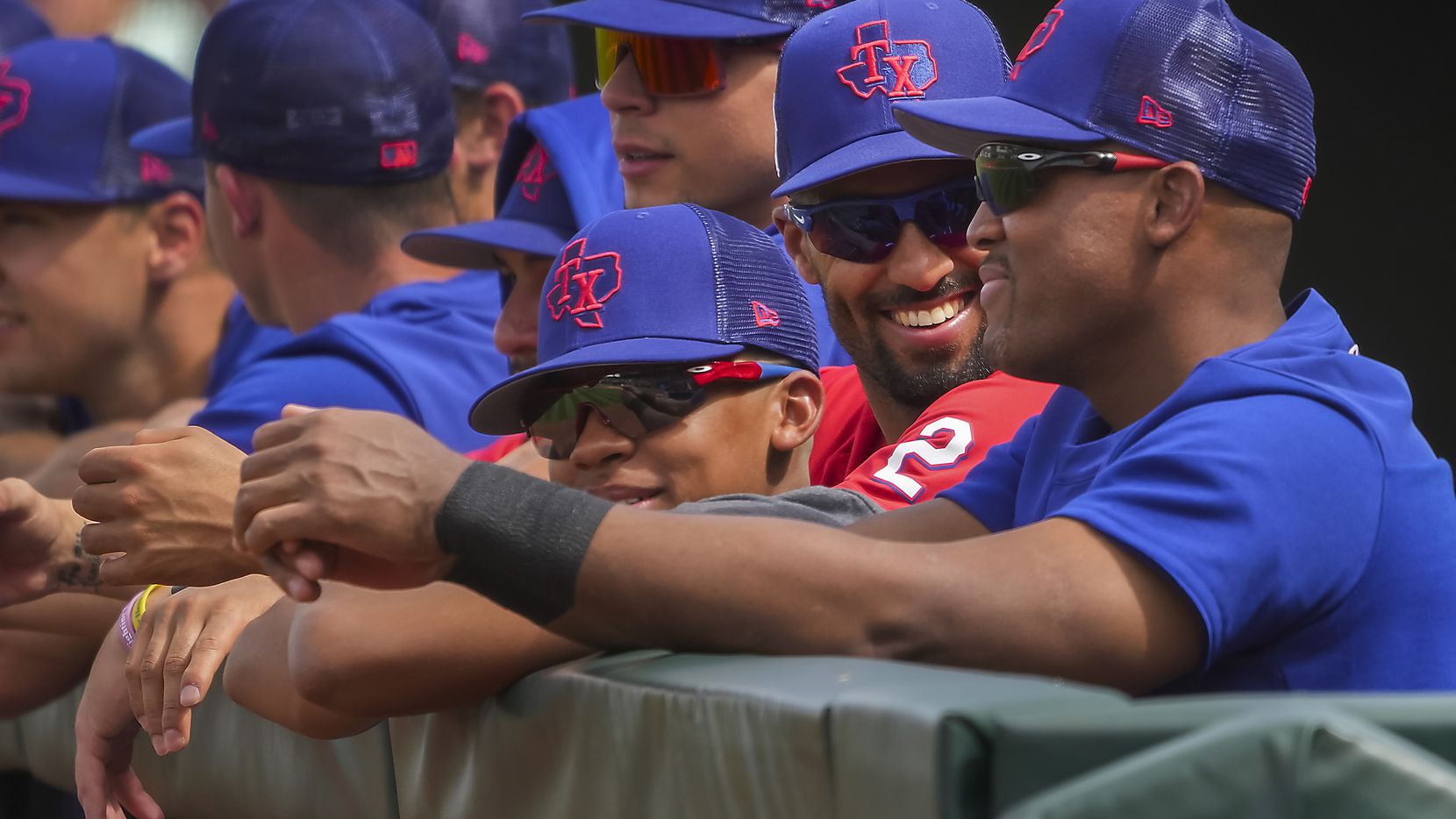 Texas Rangers infielder Marcus Semien (2) laughs with former Rangers third baseman Adrian...