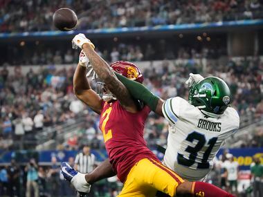 Tulane safety Larry Brooks (31) breaks up a pass intended for USC wide receiver Brenden Rice...