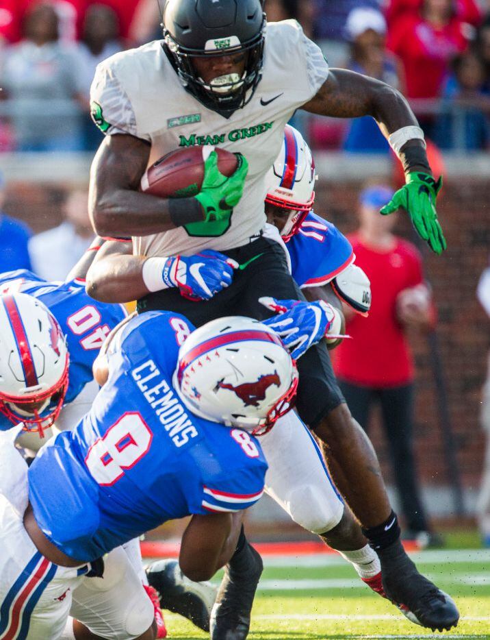 North Texas Mean Green running back Jeffery Wilson (3) is tackled by Southern Methodist...