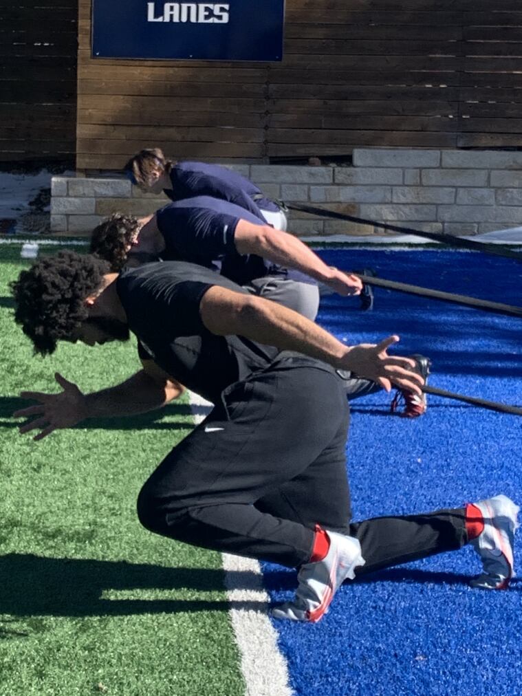 Coker (far end) runs with Becker (center) and Granson as they trained for SMU's pro day.