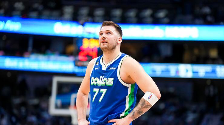 Dallas Mavericks guard Luka Doncic looks up at the scoreboard during the first half of an...