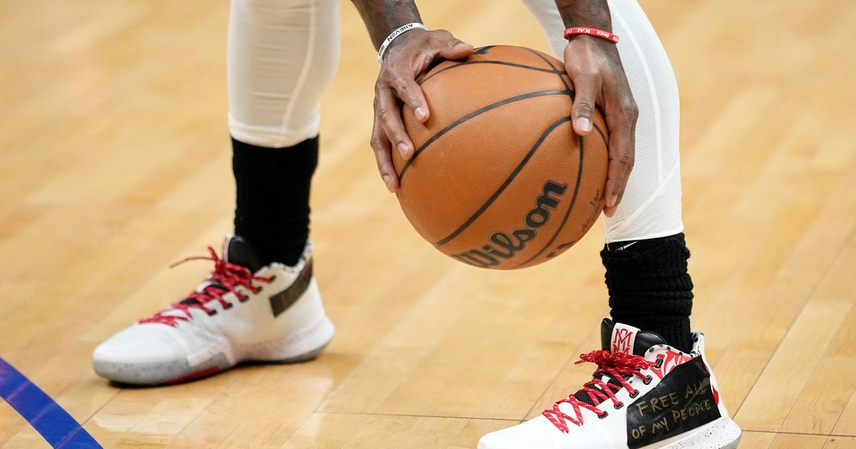 What did Kyrie Irving write on his Nike shoes for first game with Dallas Mavericks?