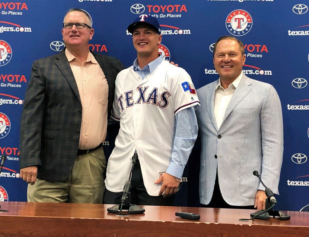 Texas Rangers senior director of amateur scouting Kip Fagg; Josh Jung, the baseball team's...