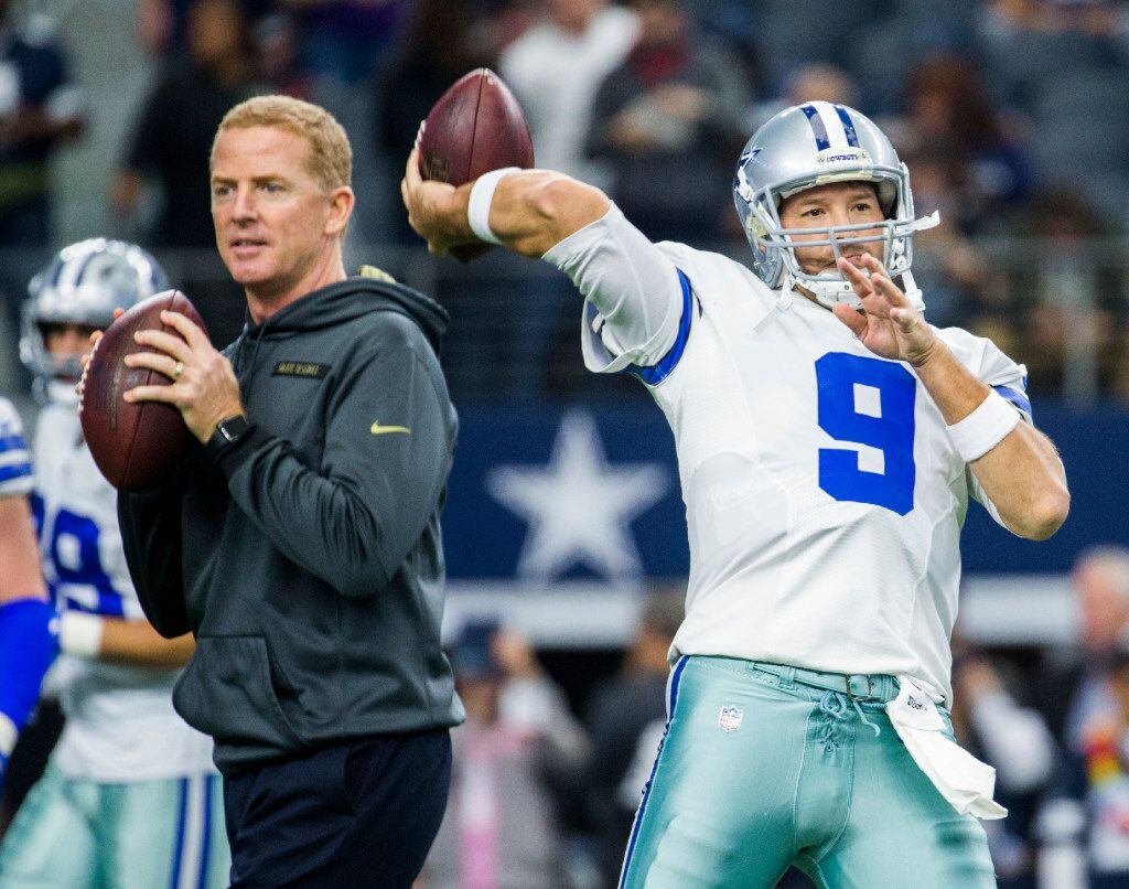 Dallas Cowboys quarterback Tony Romo (9) warms up alongside Dallas Cowboys head coach Jason...