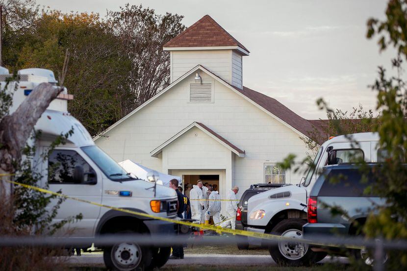 Investigators worked at the scene of the deadly shooting at the First Baptist Church in...