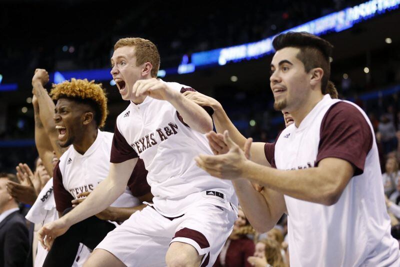Texas A&M Aggies guard Kyle Dobbins (25) and teammates celebrate as they mount a comeback...