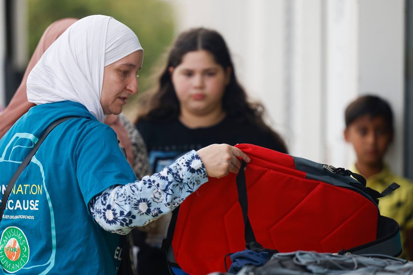 ICNA Relief USA director Hala Halabi organized free school bags during a back-to-school and...