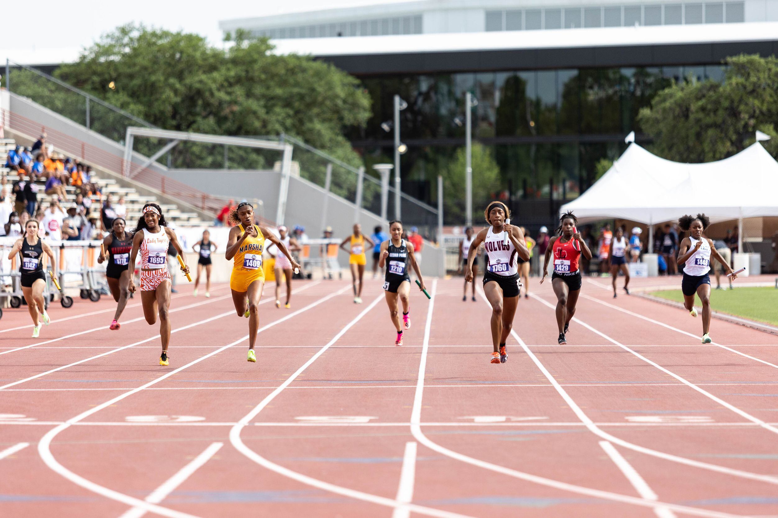 Lola Mabon, third from the right, anchors the girls’ 4x100 relay for Mansfield Timberview at...