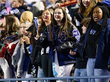 Dallas Christian fans cheer during the first half of the TAPPS Division III state...