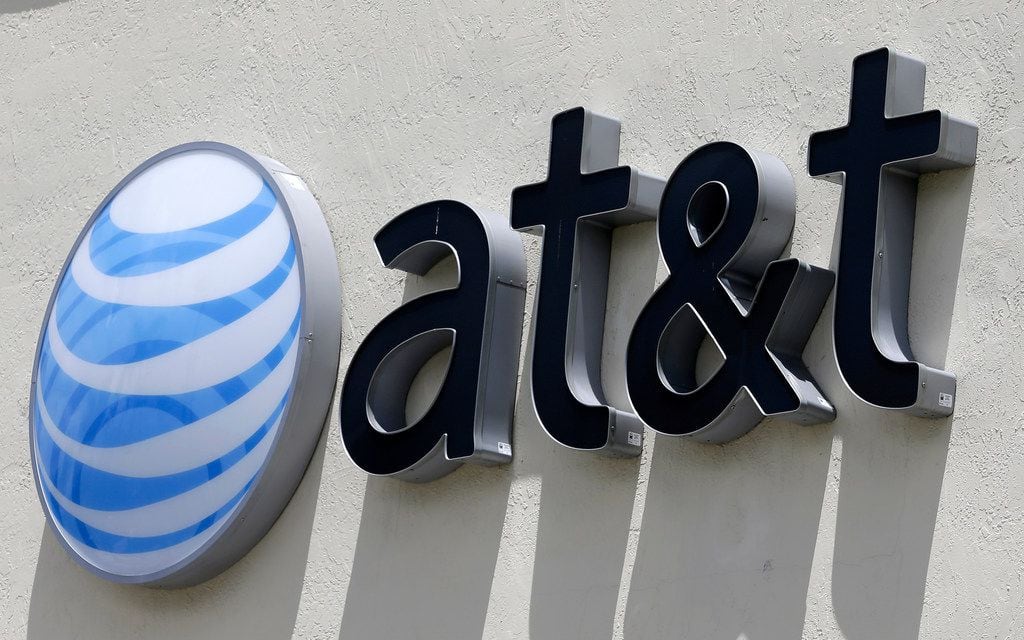 FILE - This Thursday, July 27, 2017, file photo shows an AT&T logo at a store in Hialeah,...