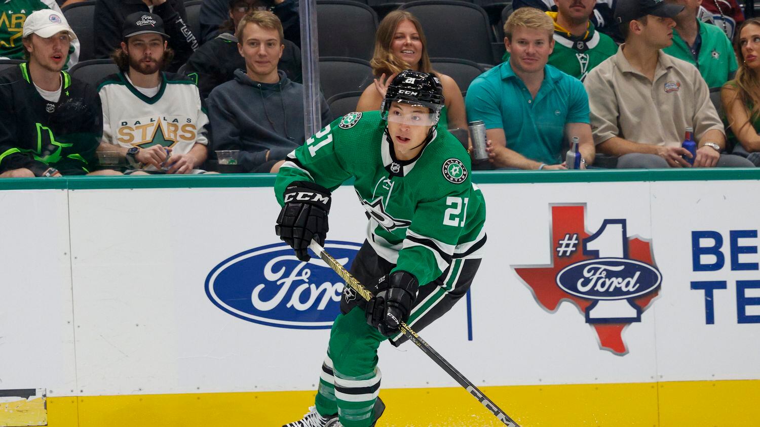 Dallas Stars left wing Jason Robertson (21) skates with the puck during the first period of...