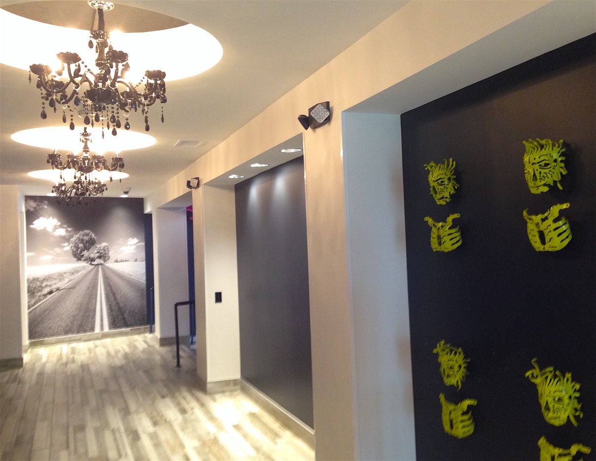 Hallways in the Lorenzo Hotel have photos and artwork.
