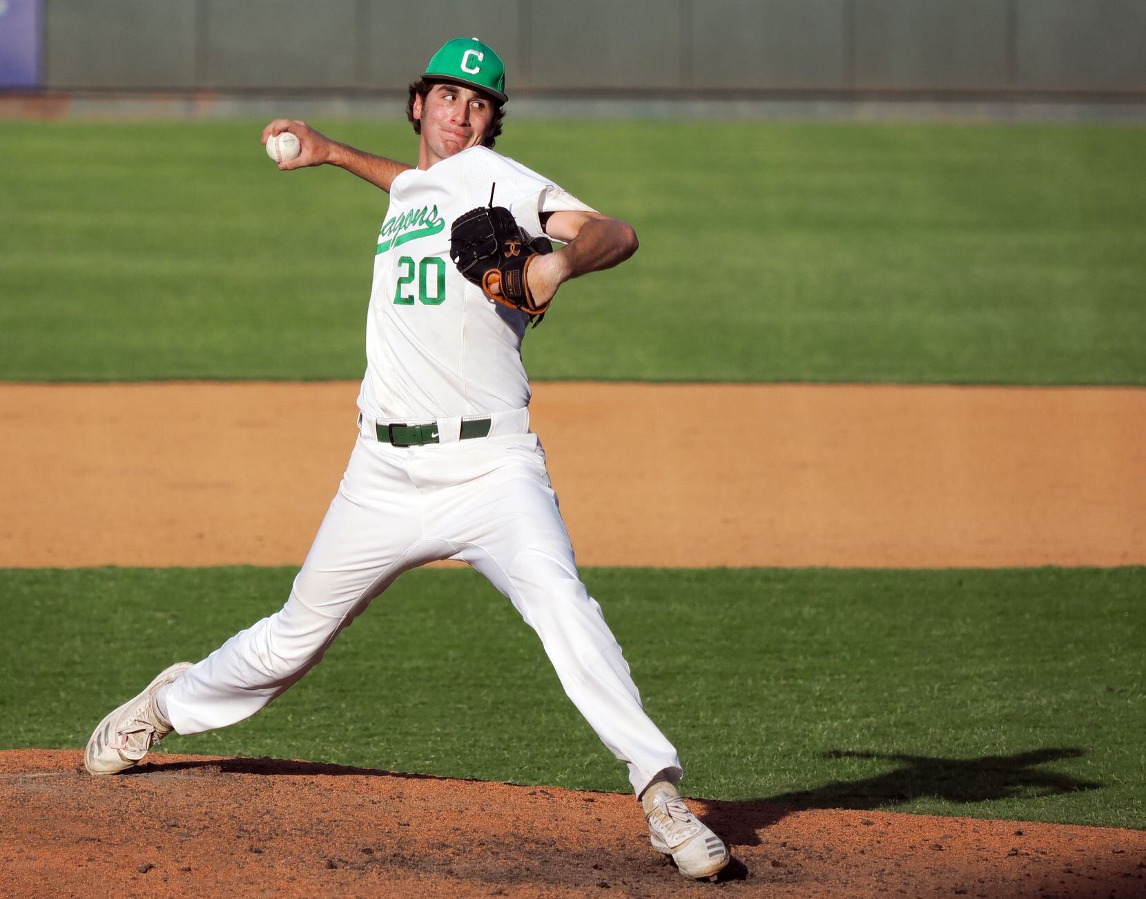 Southlake Carroll relief pitcher Tyler White (20) pitches the final strike to defeat San...