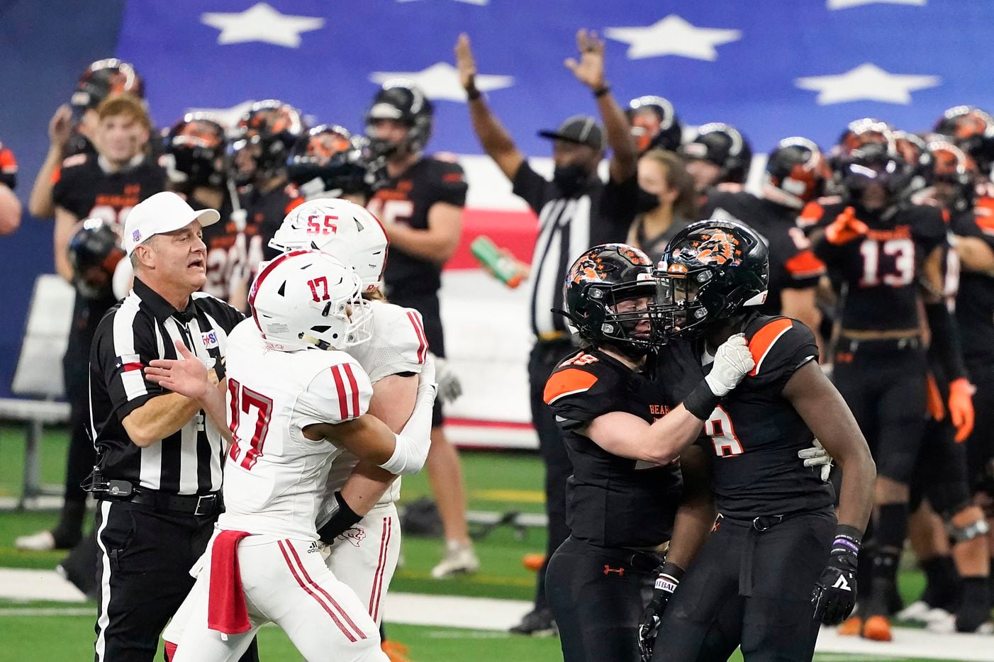 Teammates and officials race to separate Crosby offensive lineman Tyler Thomas (55) from Aledo defensive lineman Chris Wright (8), who were both penalized on the play, during the first half of the Class 5A Division II state football championship game at AT&T Stadium on Friday, Jan. 15, 2021, in Arlington. (Smiley N. Pool/The Dallas Morning News)
