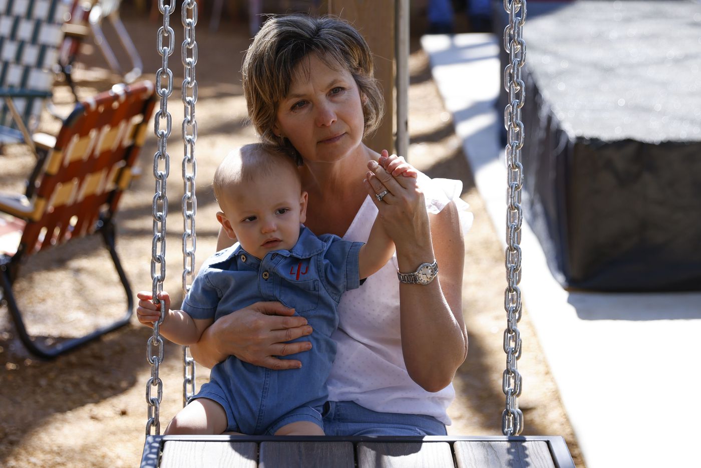 Zagorka Ingoglia spends time her 14-month-old grandson Luka while sitting on the new swing...