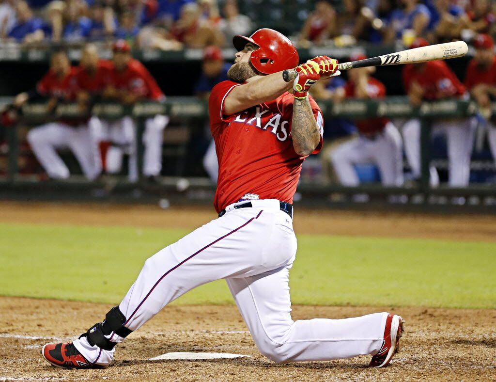 Texas Rangers left fielder Mike Napoli fouls out during the fourth inning against the...