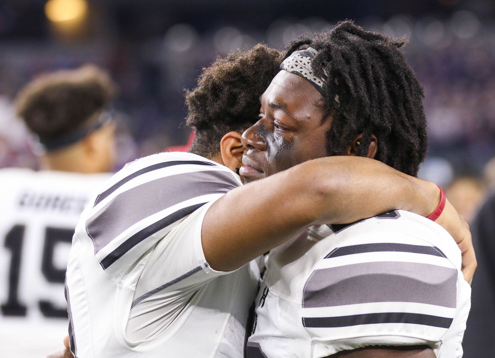 Denton Guyer players hug after losing a Class 6A Division II state championship game against...