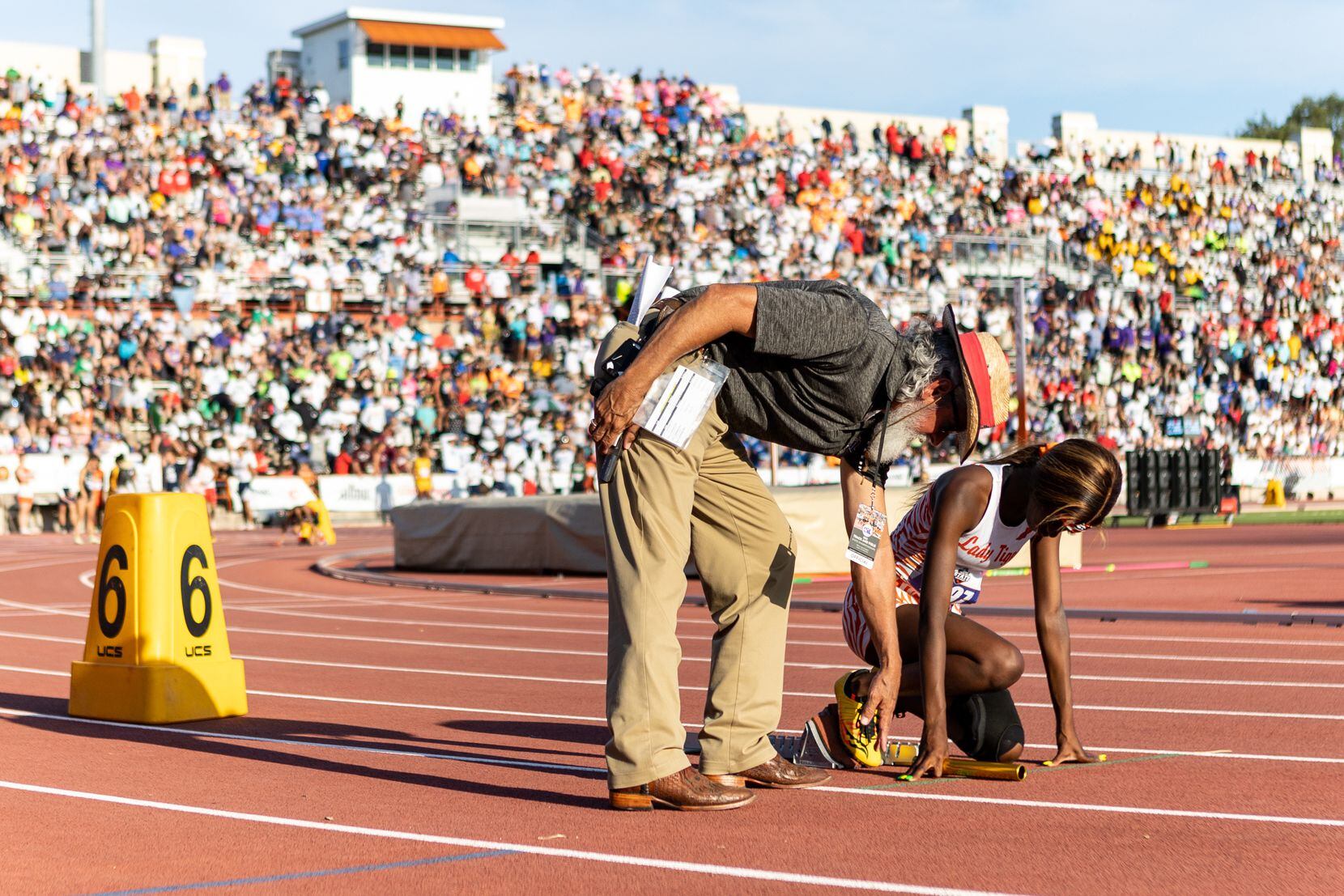 Leeira Williams prepares to lead off the girls’ 4x200 relay for Lancaster at the UIL Track &...