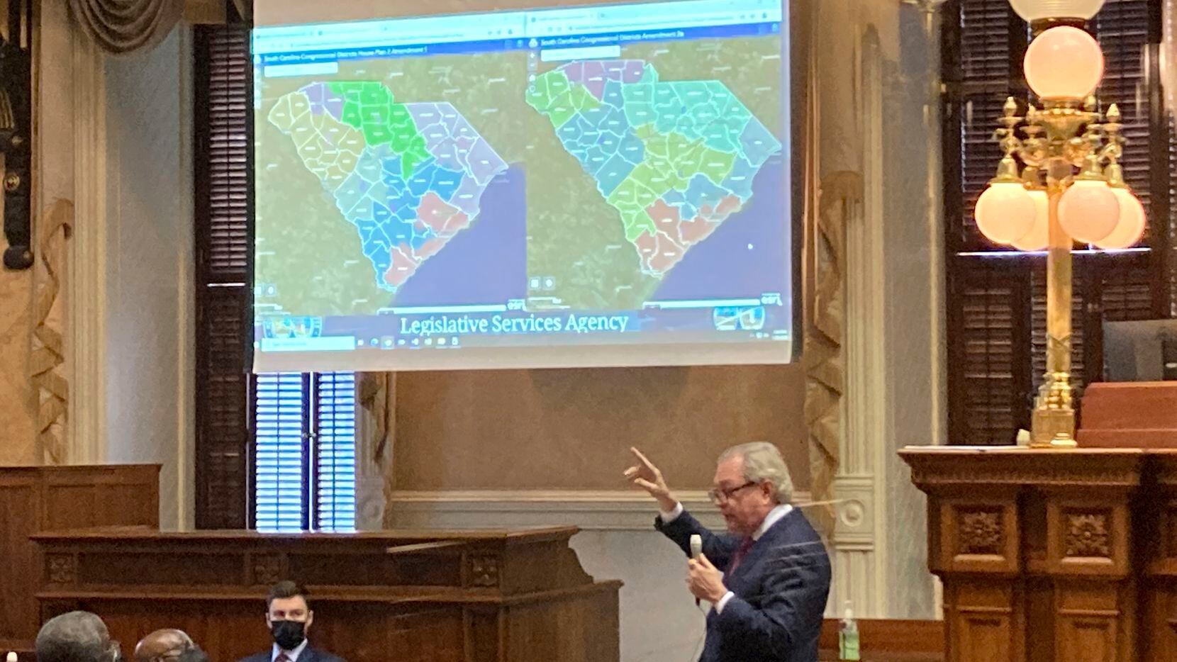 FILE - State Sen. Dick Harpootlian, D-Columbia, compares his proposed map of U.S. House...