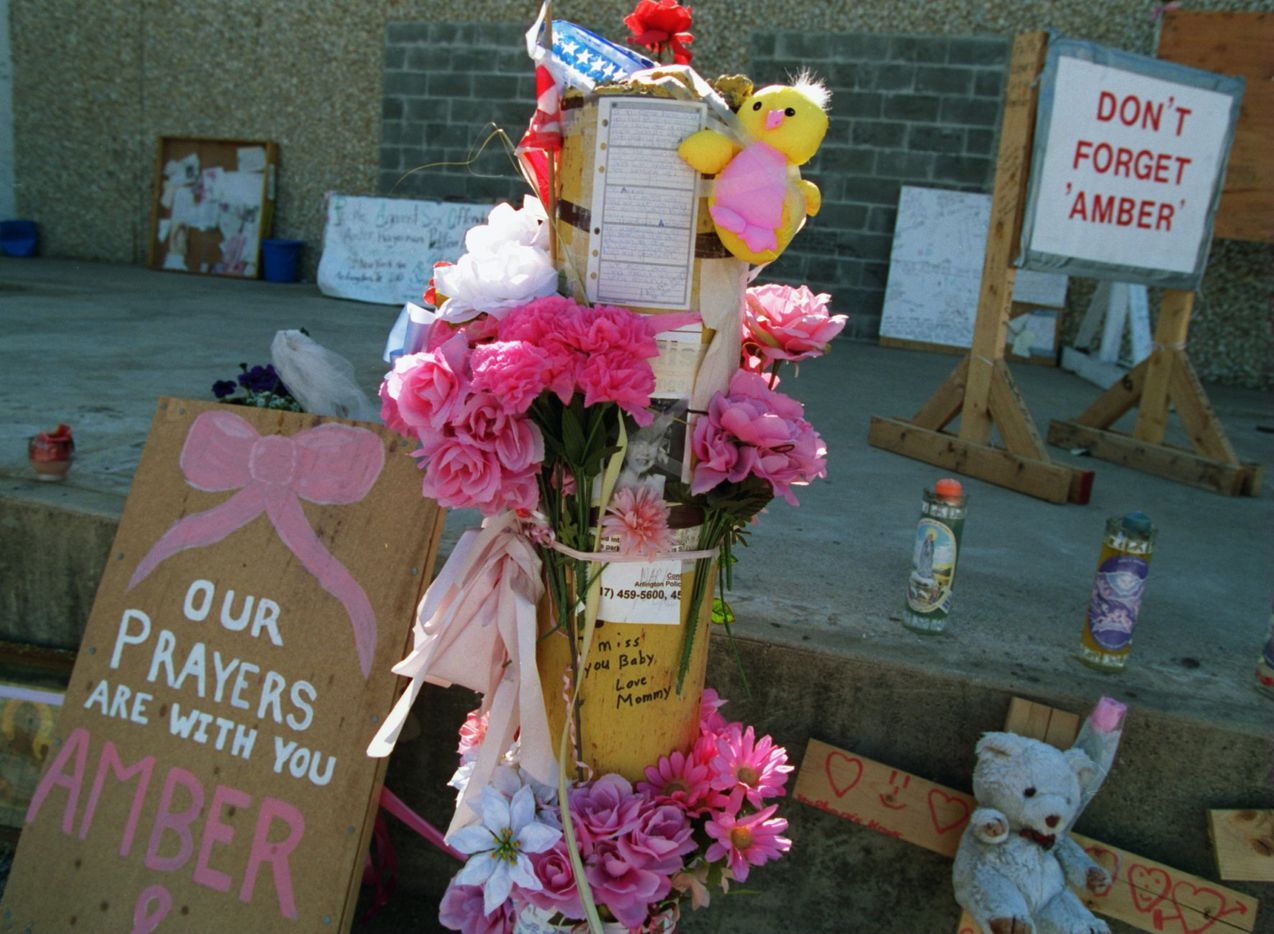 The makeshift memorial to murder victim Amber Hagerman in a vacant parking lot that used to...