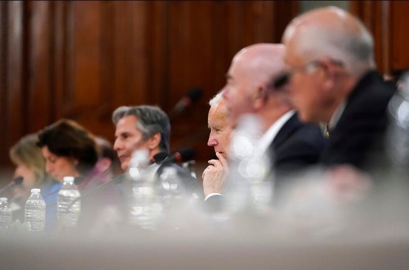 President Joe Biden, third from right, listens during a meeting bilateral meeting with...