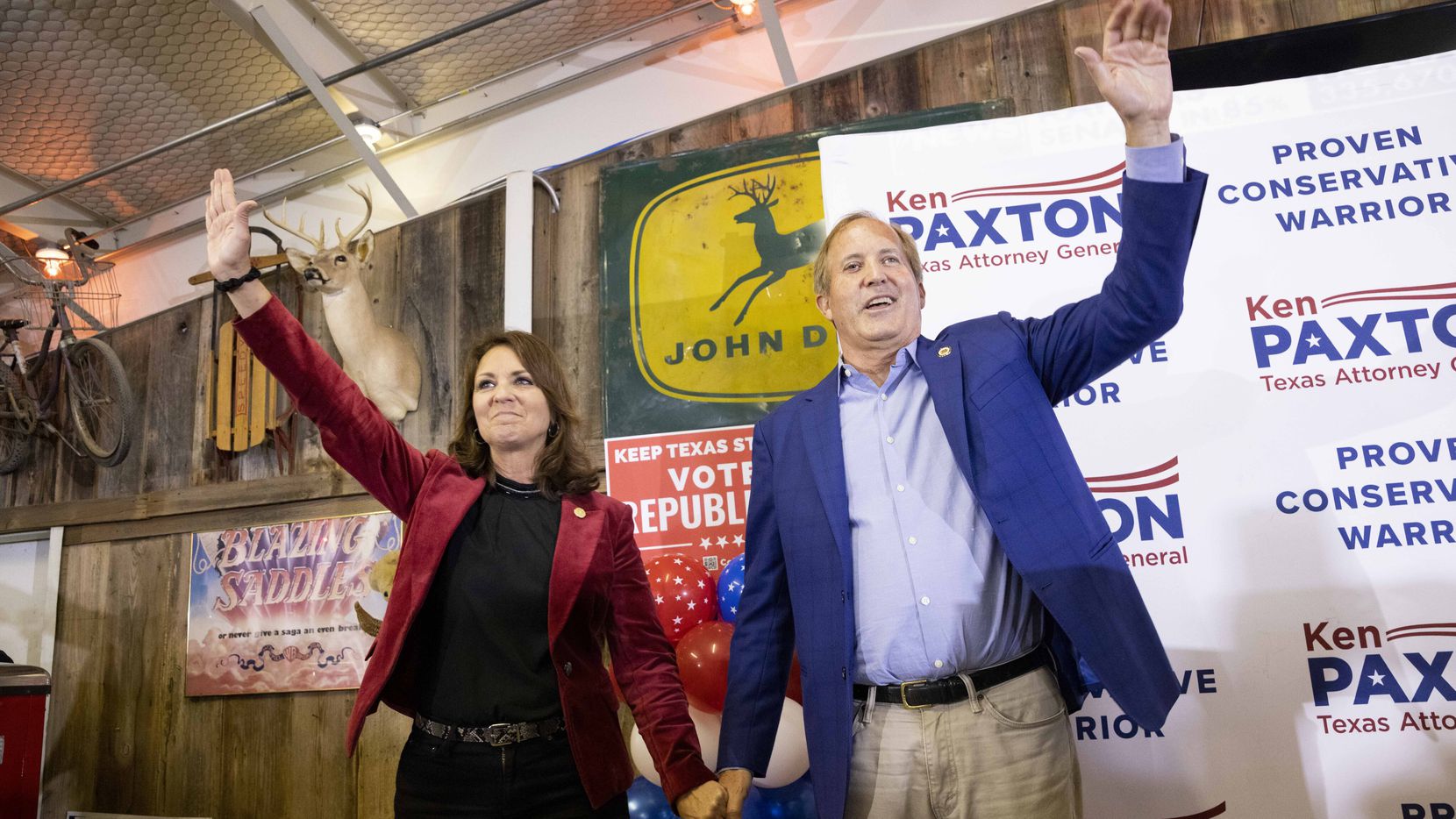 Sen. Angela Paxton and husband Attorney General Ken Paxton wave to the crowd during a Collin...