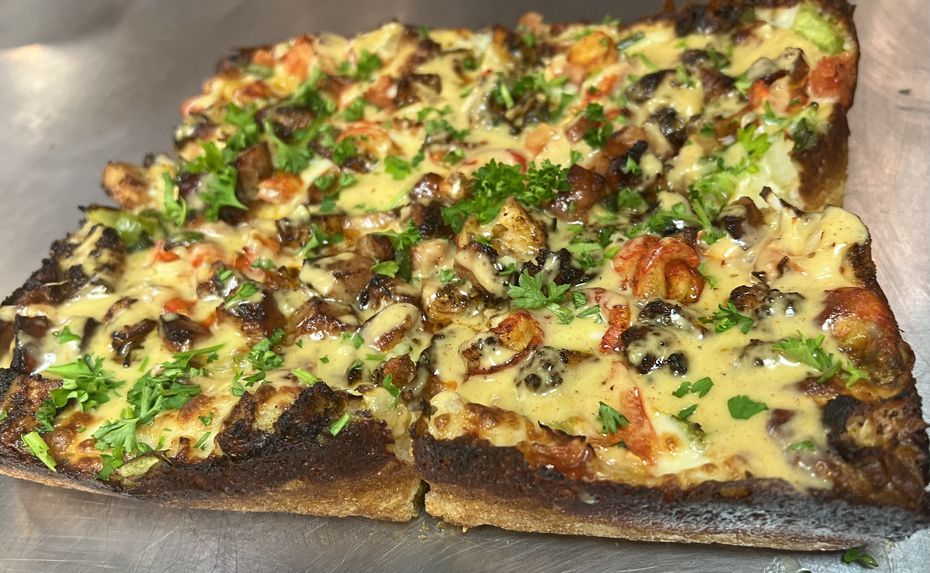 "The Dak" is a specialty pizza at Motor City in Lewisville that comes topped with jambalaya:...