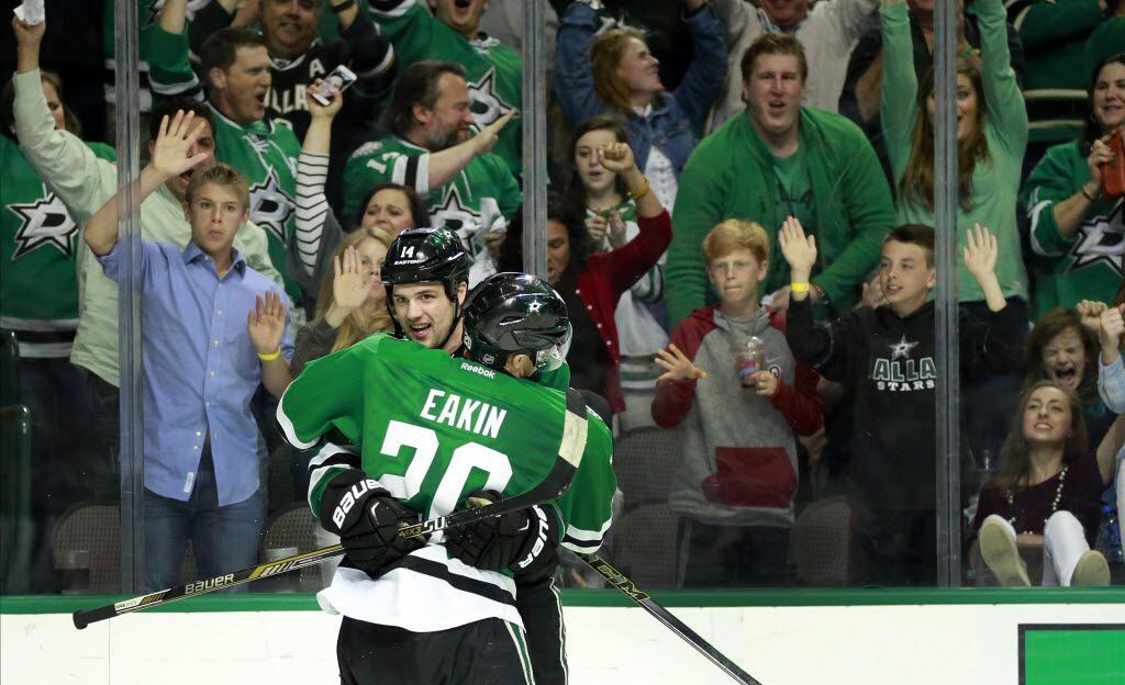 Dallas Stars left wing Jamie Benn (facing) is congratulated by center Cody Eakin (20) after scoring a third period goal during Game 2 of the Western Conference Quarterfinals at the American Airlines Center in Dallas, Saturday, April 16, 2016. The Stars won, 2-1, to go up 2-0 in the series. (Tom Fox/The Dallas Morning News)