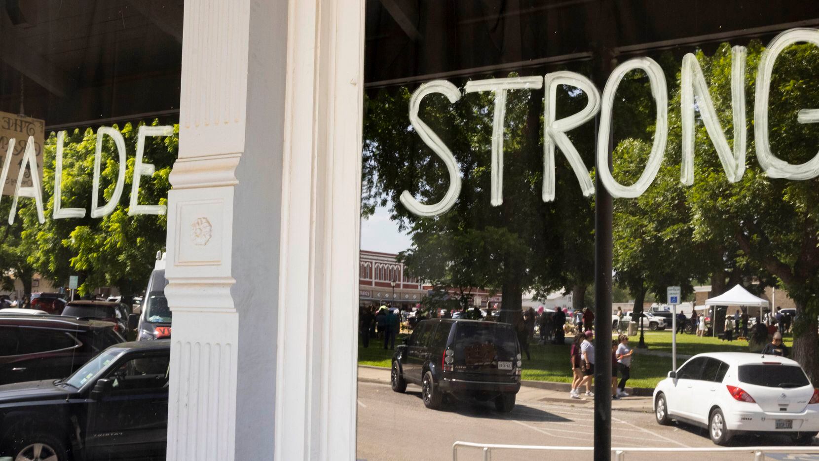 Uvalde Strong written on the window at The Uvalde Grand Opera House in memory of the 19...