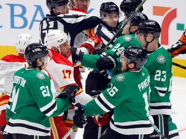 A scuffle with the Calgary Flames in front of the Dallas Stars net during the second period...