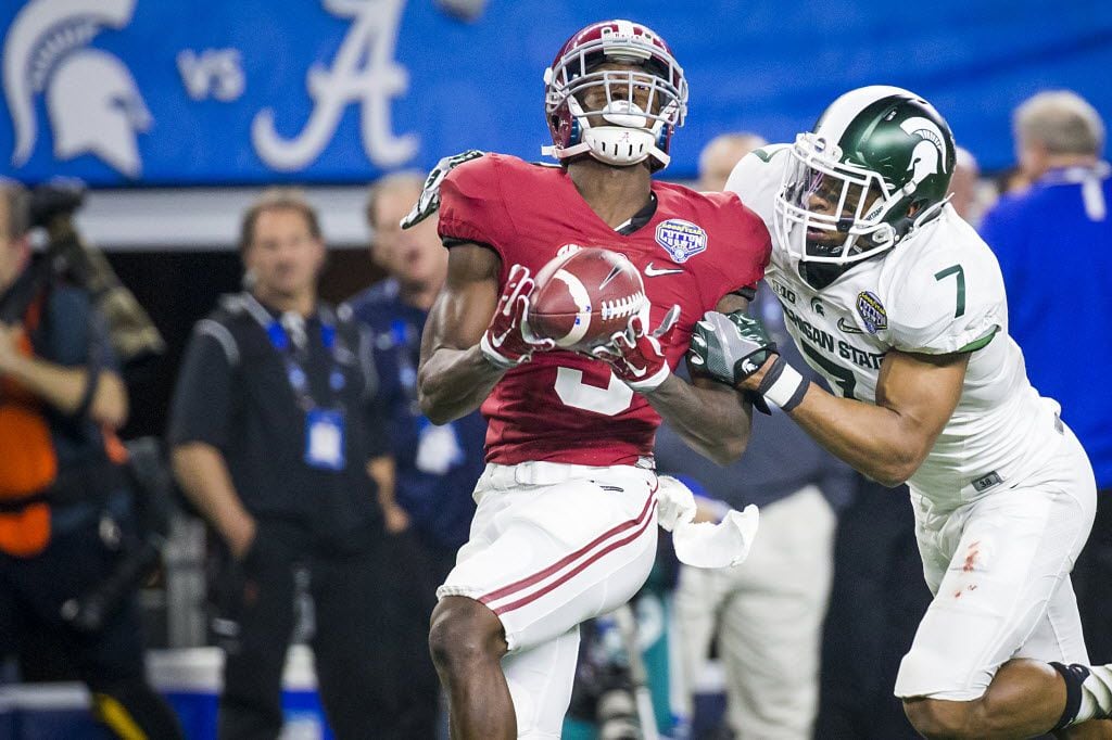 Alabama wide receiver Calvin Ridley (3) hauls in a  50-yard pass to setup a touchdown as Michigan State defensive back Demetrious Cox (7) defends during the first half of the Goodyear Cotton Bowl game at AT&T Stadium on Thursday, Dec. 31, 2015, in Arlington. (Smiley N. Pool/The Dallas Morning News)