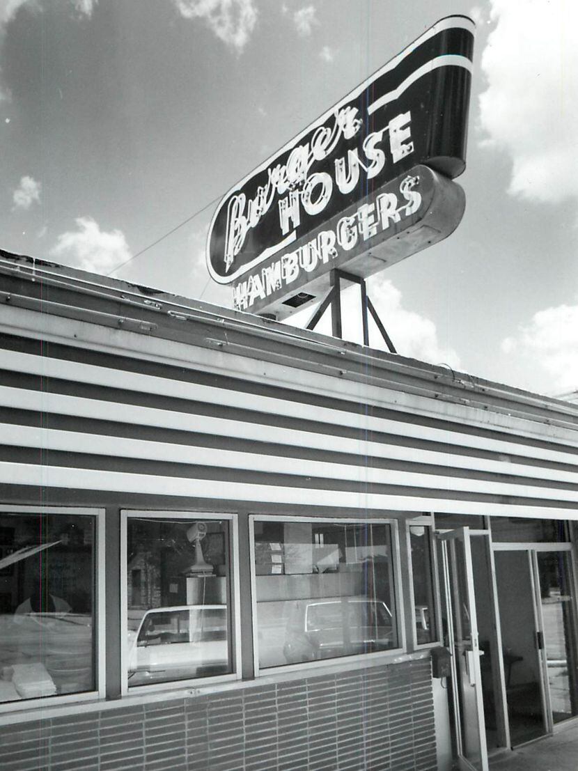 Burger House opened in Snider Plaza in 1951. Cooks give a hefty shake of "secret" salt on...