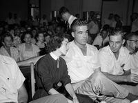 In this Sept. 22. 1955 photo, Carolyn Bryant rests her head on her husband Roy Bryant's...