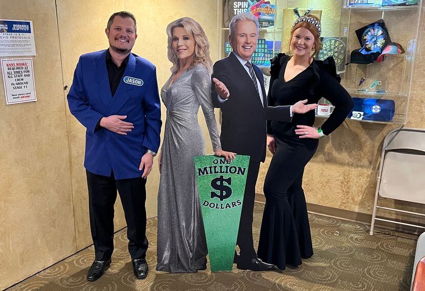 Jason White of Fort Worth and his wife, Karin (right), pose with cutouts of Vanna White and...