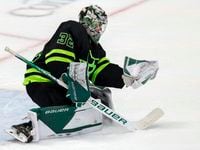 Dallas Stars goaltender Matt Murray (32) saves a shot in the crease during the second period...