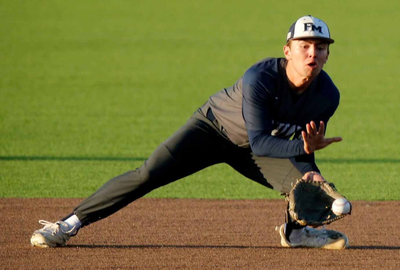 Flower Mound High School shortstop Chris Kelley (3) was able to make the throw after...