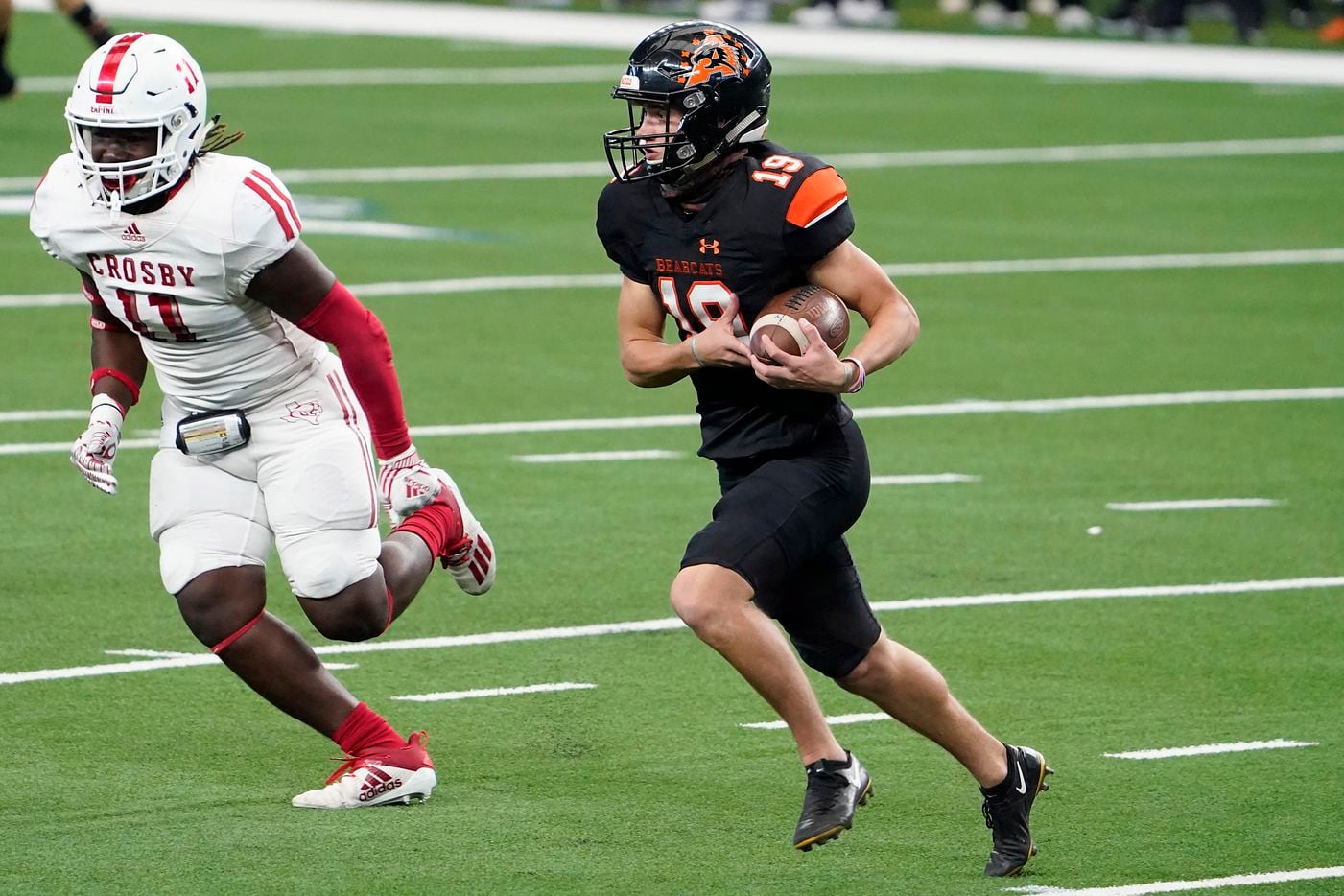 Aledo punder Clay Murador (19) gets past Crosby linebacker Jamauri Johnson (11) for a first down on a fake punt during the first half of the Class 5A Division II state football championship game at AT&T Stadium on Friday, Jan. 15, 2021, in Arlington. (Smiley N. Pool/The Dallas Morning News)