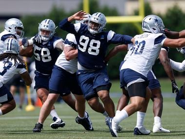Dallas Cowboys rookie defensive tackle Quinton Bohanna (98) gets through the offensive line during team drills at rookie minicamp at The Star in Frisco, Texas, Saturday, May 15, 2021.
