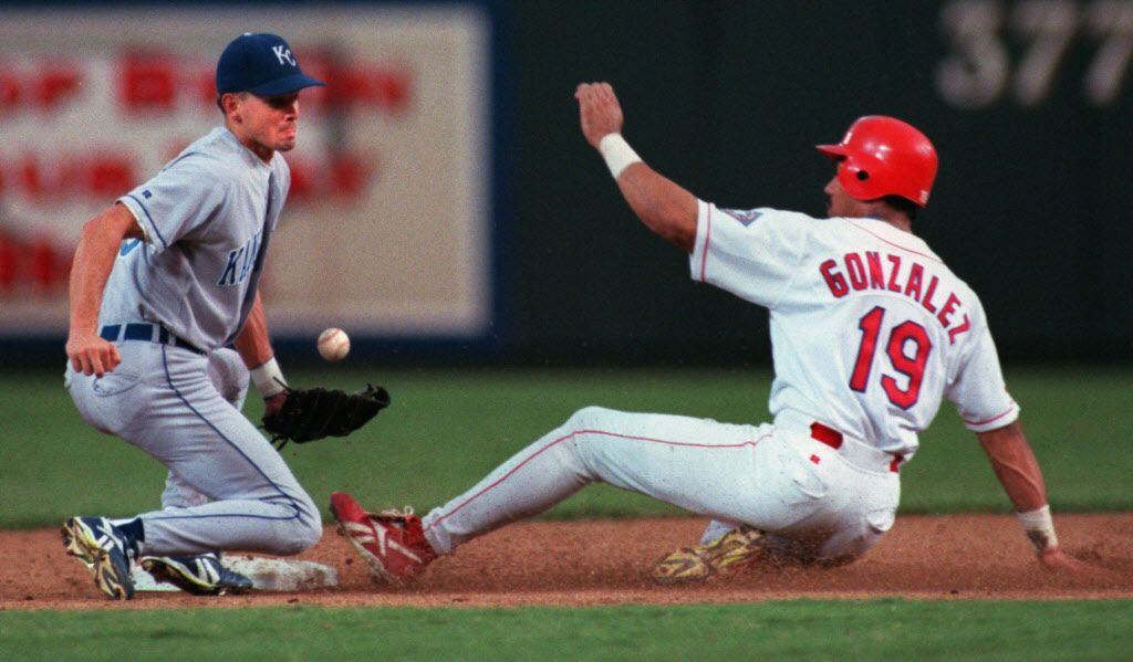 Caption: 8/18/96--Ballpark in Arlington--Rangers  Juan Gonzalez slides safely into second...