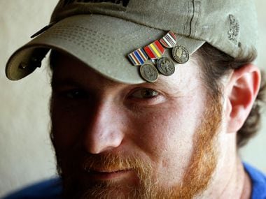 Joshua Raines poses for a portrait in his home in Springtown, Texas, on Thursday, June 13, 2019. Raines is a Purple Heart recipient and a former Army soldier who did tours in Iraq and Afghanistan. After surviving a bomb explosion in Afghanistan that left him with severe traumatic brain injury, he began having seizures and was diagnosed with PTSD when he returned to the U.S. He now uses CBD oil to control his seizures.