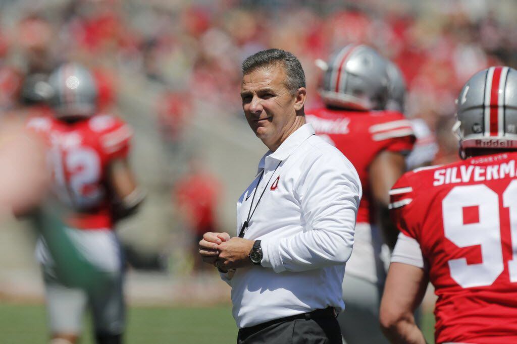 FILE - In this April 16, 2016, file photo, Ohio State head coach Urban Meyer watches the...