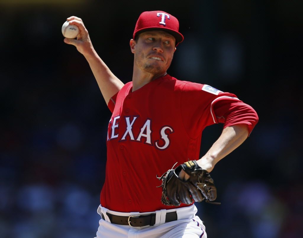 Texas Rangers starting pitcher Lucas Harrell delivers to the Kansas City Royals during the...