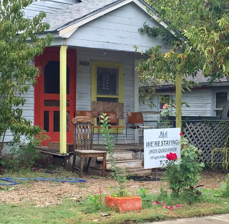 This HMK house on Rutz Street is one of many with signs that say they are staying since an...