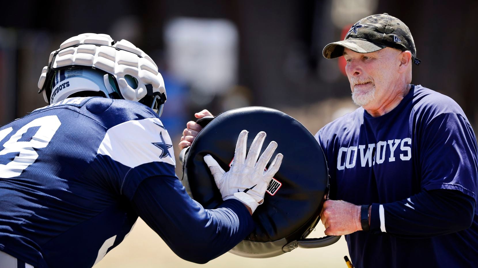 Dallas Cowboys defensive coordinator Dan Quinn winces as defensive tackle Quinton Bohanna...