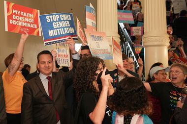 Jonathan Saenz of Texas Values counterprotests during a rally against SB14 which would ban...