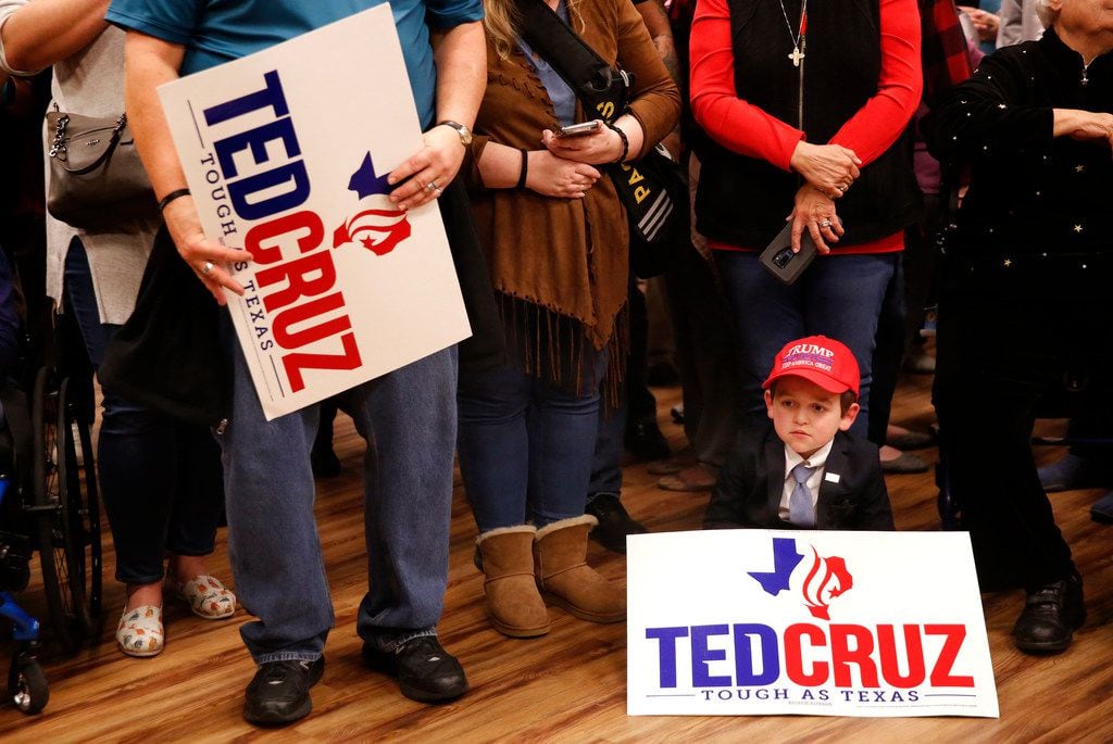 Matthew Allen, 7, waits for Sen. Ted Cruz to speak during a campaign rally at Sharon Shrine...