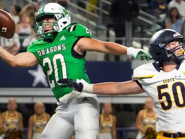 Southlake Carroll running back James Lehman (20) makes a one-handed catch for a touchdown as...