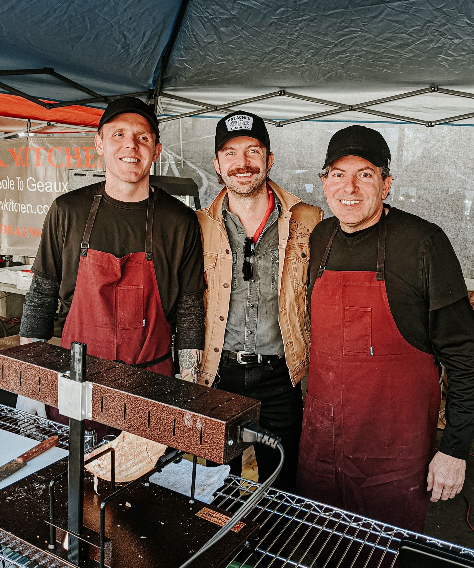 Rich Rogers (far right) and the team from Scardello Artisan Cheese make raclette sandwiches...