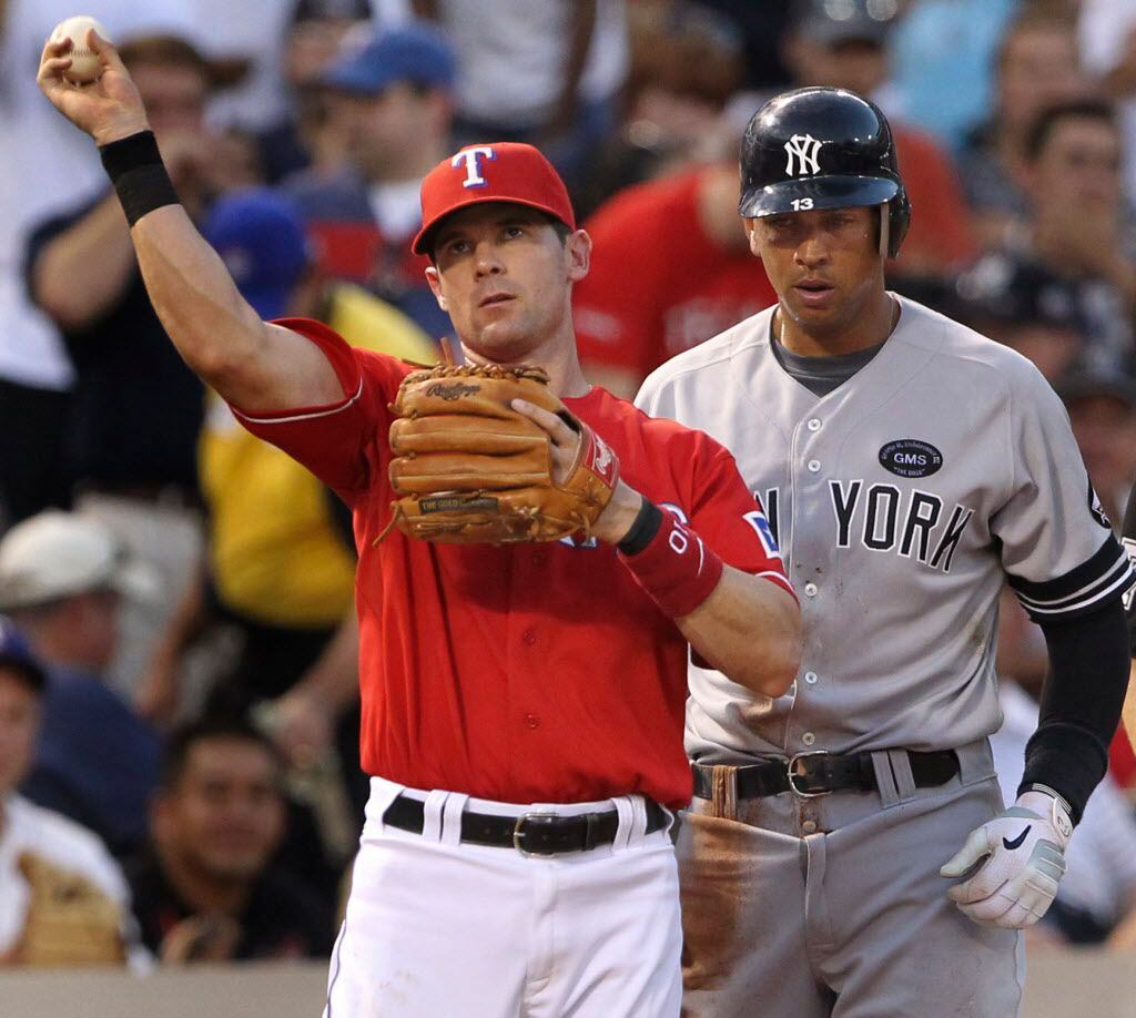Texas 3B Michael Young and NY 3B Alex Rodriguez are pictured during the New York Yankees vs....